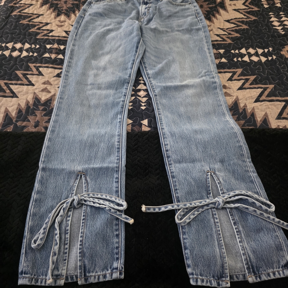 Stylish Women's Light Blue Jeans with Bow Accents